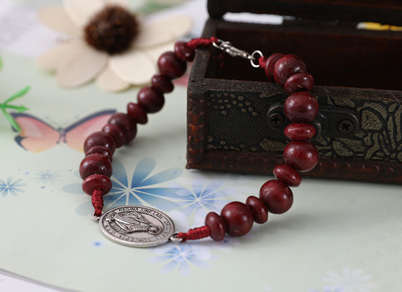 Dark red cord bracelet with pendant