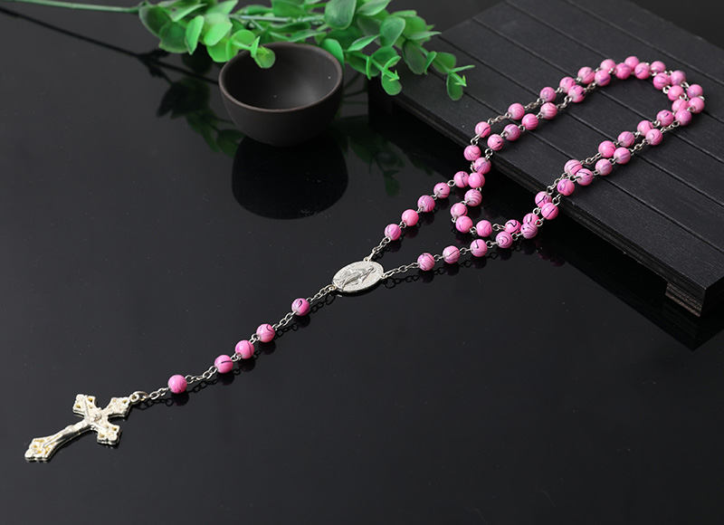 pink plastic religious rosary necklace